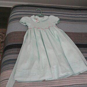 Marmellata Smocked Girls dress Size 6 Has flowers and lining under the dress